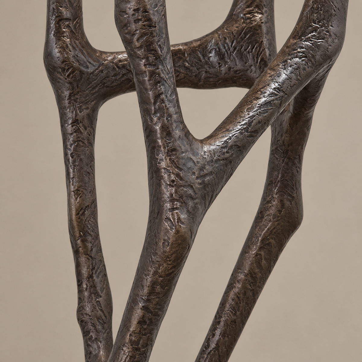 Close-up of CL002's textured dark fiberglass branches and irregular joints.