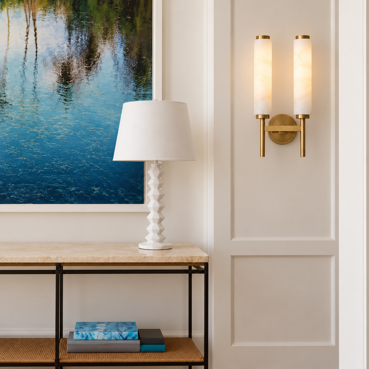 Two-cylinder alabaster and brass wall sconce shown straight on, with its circular plate centered behind the crossbar.