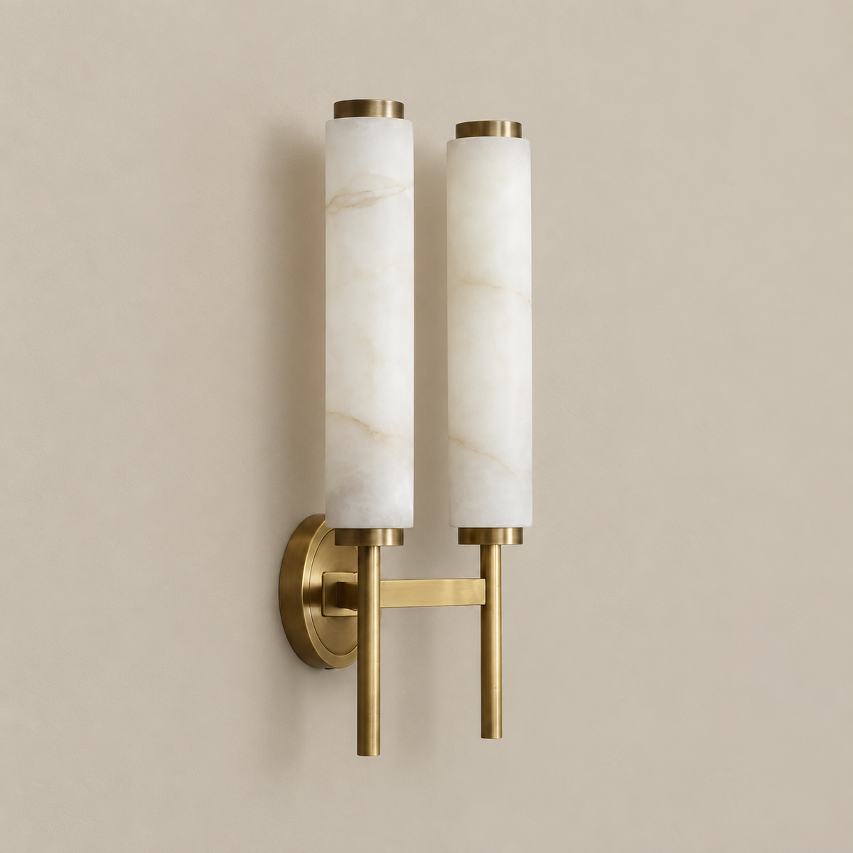 Double alabaster cylinder wall sconce in brass, switched off.