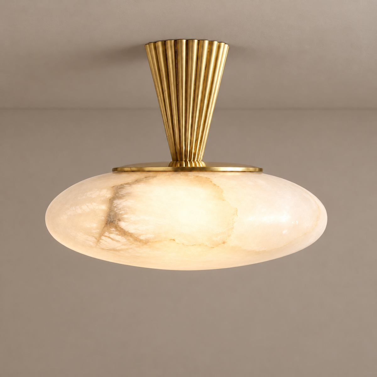 CLALF032 ceiling light illuminated through the same cloudy alabaster shade beneath its fluted brass stem.