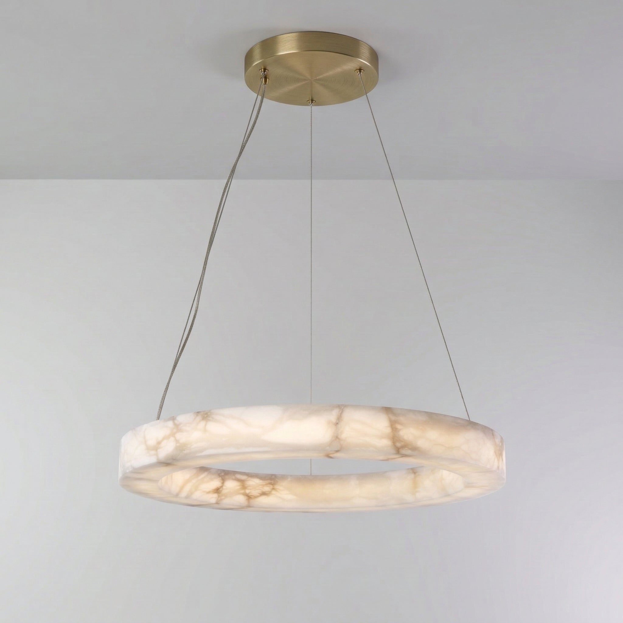 Single alabaster ring glowing from within with natural veining