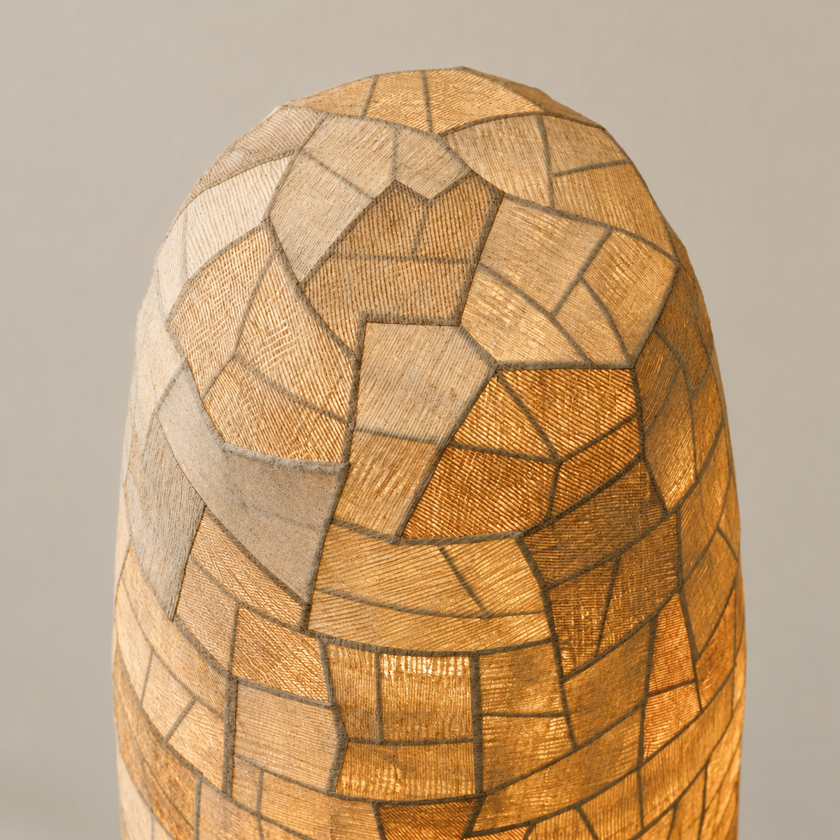 Close-up of Appia's layered fabric patches and rounded column top.