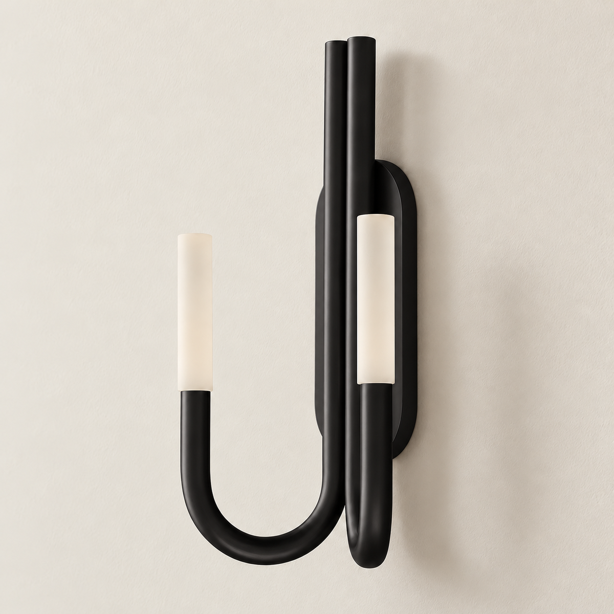 Black double-arm wall sconce mounted on an ivory wall.