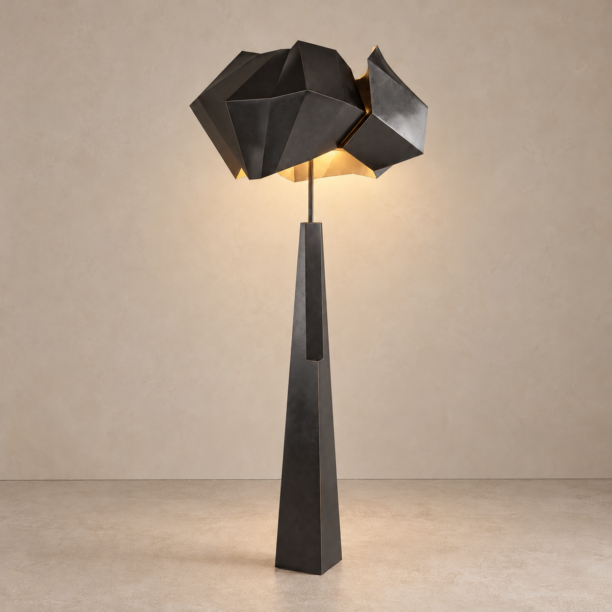 Aventine black floor lamp illuminated beneath its angular metal shade