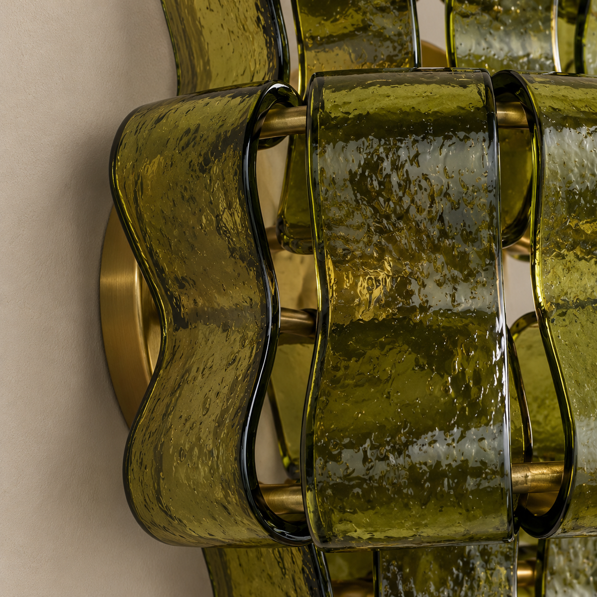 Bellatrix green glass wall sconce, close view of its materials and mounting