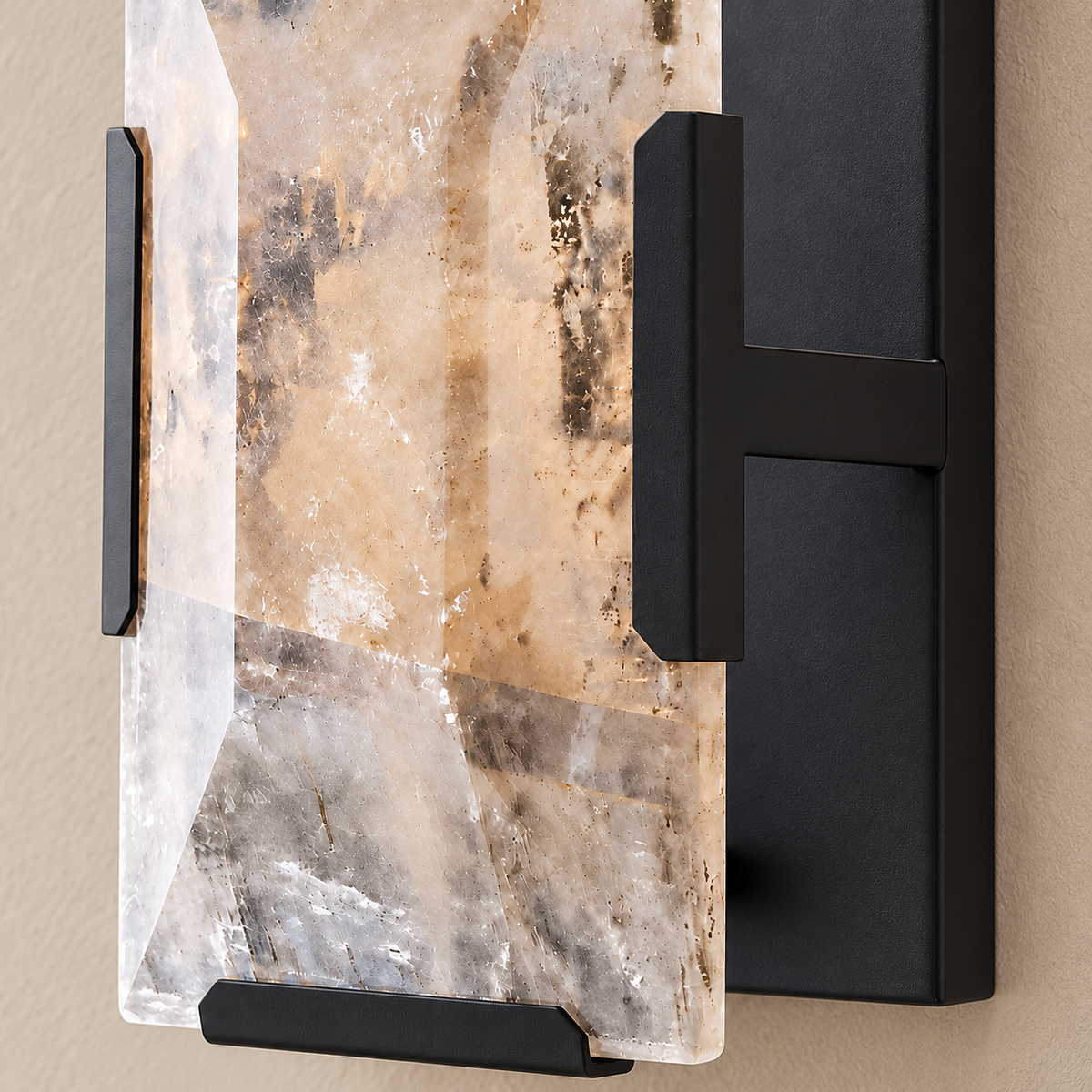 Detail of bevelled calcite and black mounting hardware.
