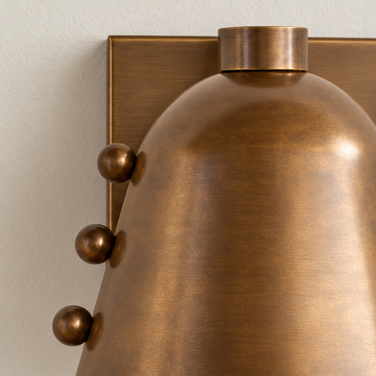 Detail of the antique brass shade, ball studs and backplate.