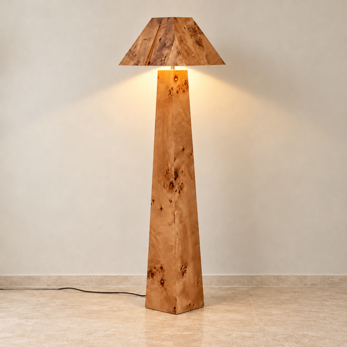 Burl wood floor lamp illuminated beneath its angular wooden shade.