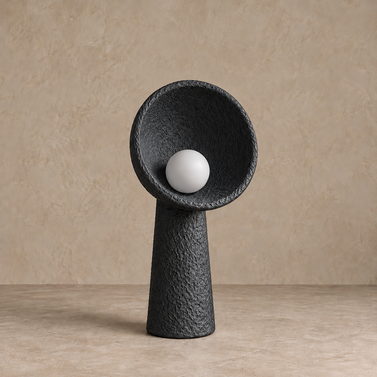 Small black Calla plaster lamp, 60 cm high with a 30 cm bowl and an unlit globe bulb.