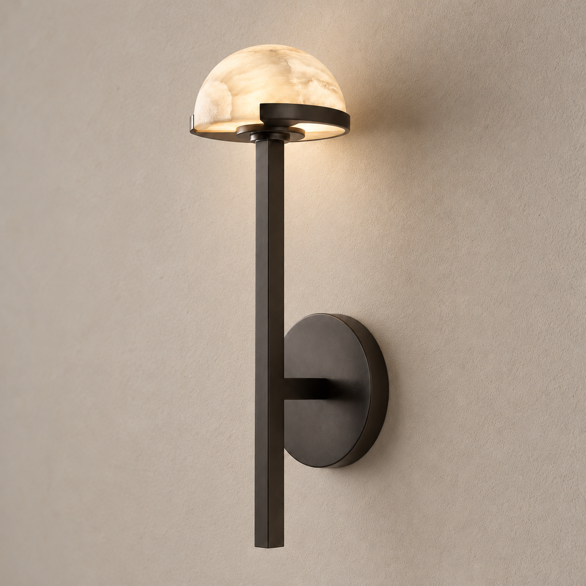 Alabaster half-dome wall sconce illuminated in natural daylight.