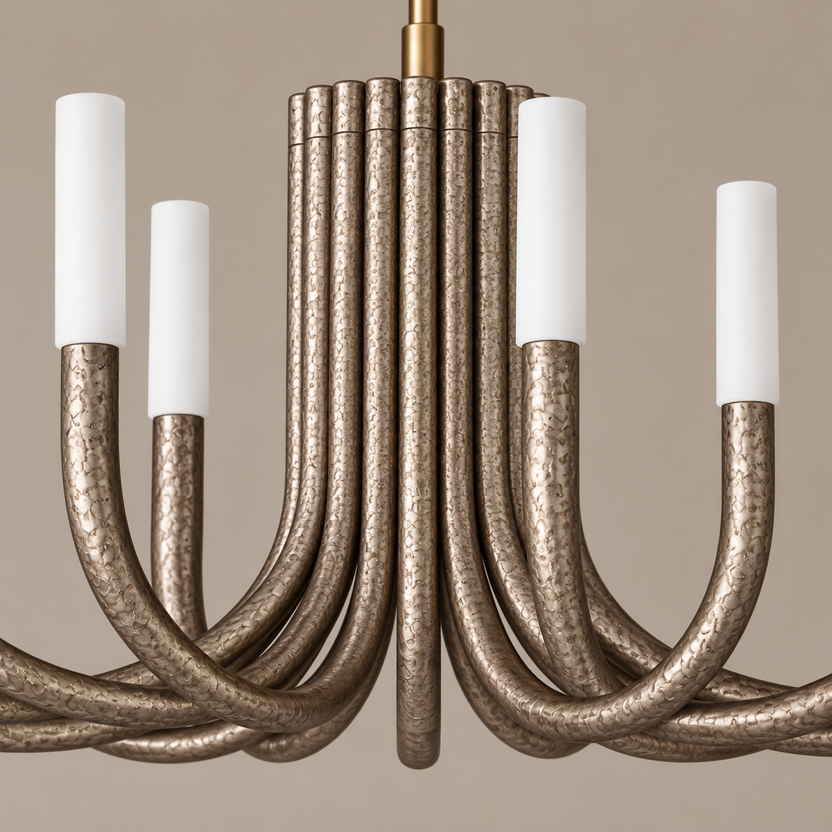 Close-up of the Grand Champagne Candelabra’s mottled metal finish and white cylindrical diffusers