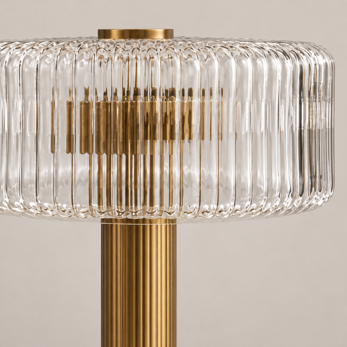 Close view of the ribbed clear glass shade and brass fittings