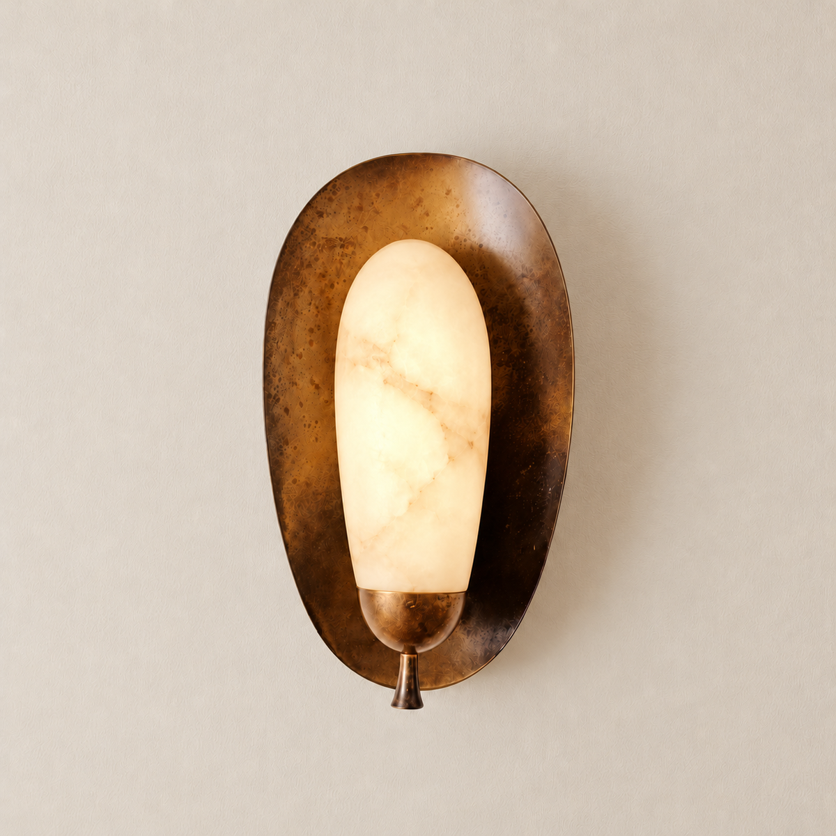 CLASYH87 alabaster and aged brass wall sconce illuminated on the same ivory background.