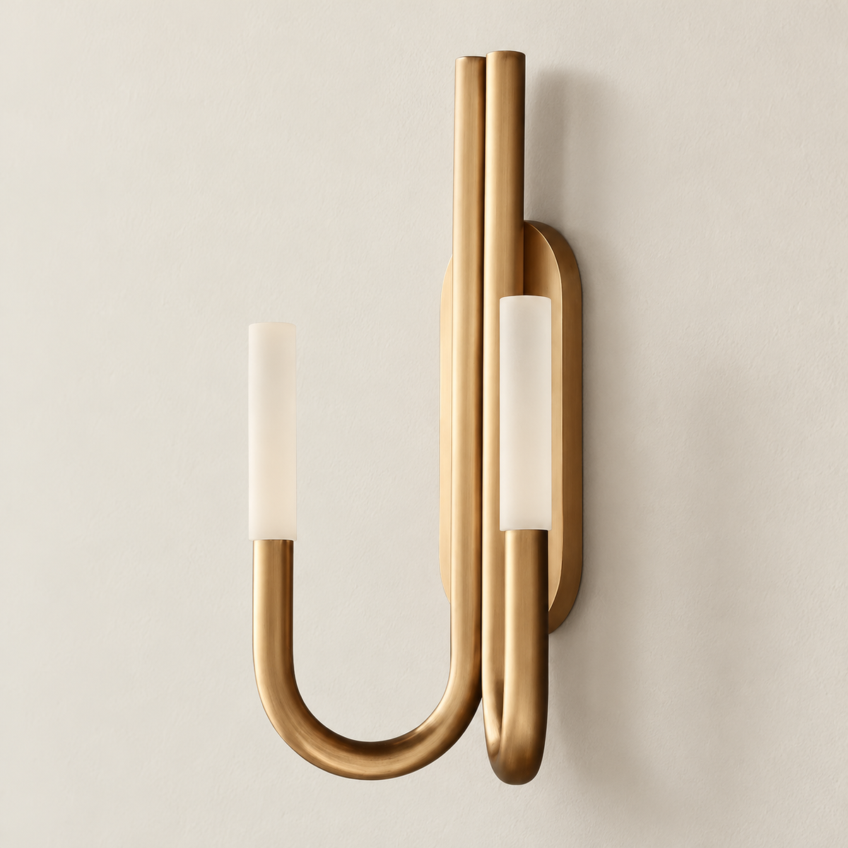 Brass double-arm wall sconce with frosted cylinder shades, switched off.