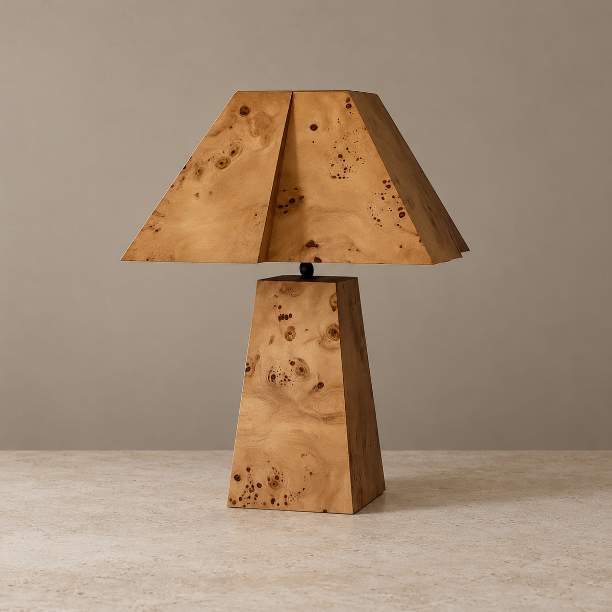 Unlit burl wood table lamp with an angular shade on a beige background.