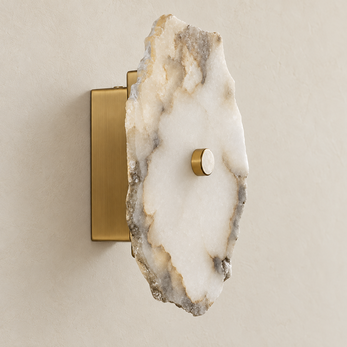 Angled view of the single marble wall sconce showing its rough stone edge and brass mounting plate.
