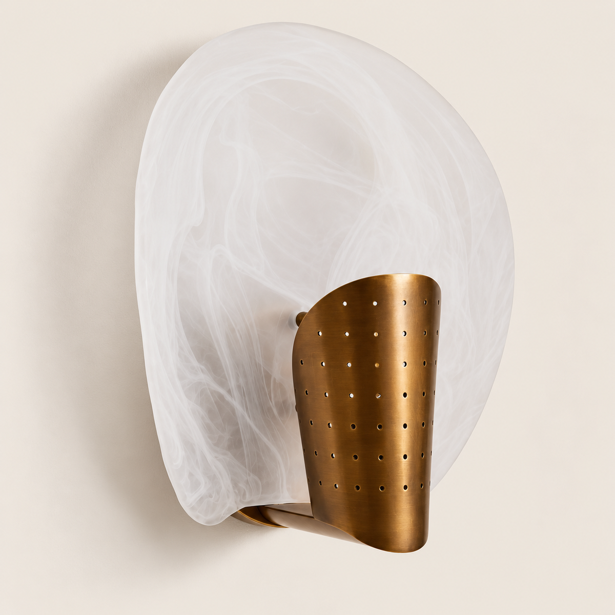 Angled view of the curved glass shade, brass cover and wall support.