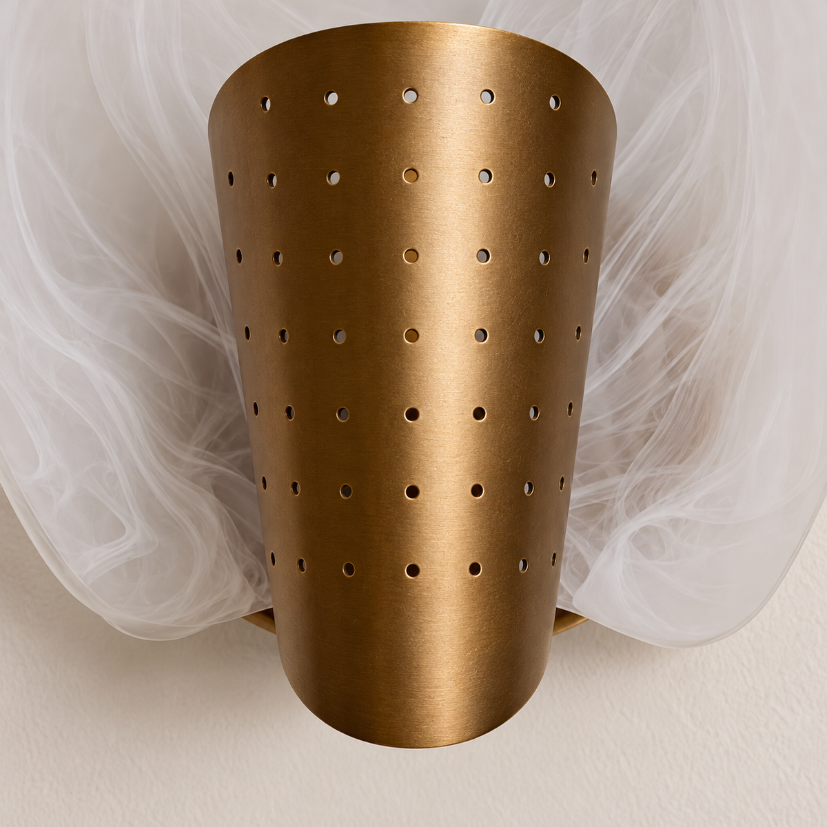 Close-up of the perforated brass cover and swirling milky glass.