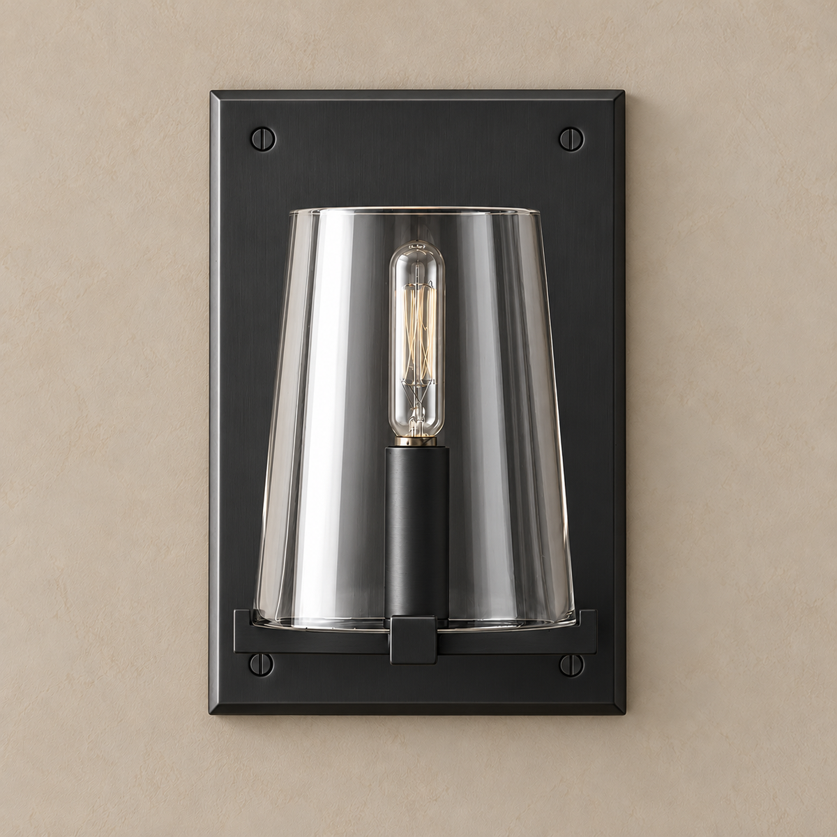 Black stainless steel wall sconce with a clear tapered glass shade, unlit on a beige wall.