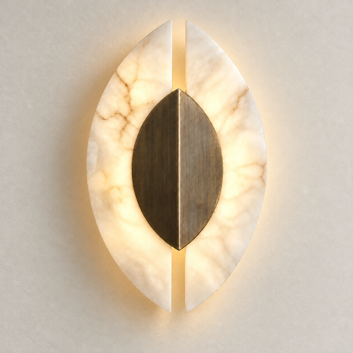 Alabaster wing wall sconce mounted on ivory plaster, illuminated.