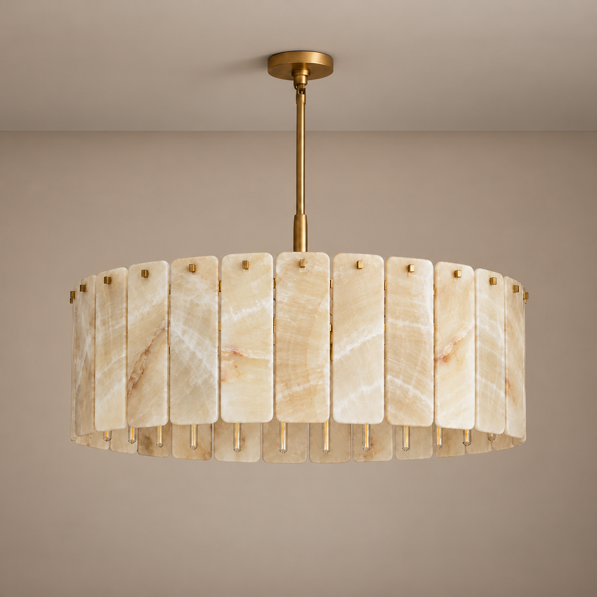 Matra Corona chandelier in honey onyx and brass, shown unlit with its full suspension.
