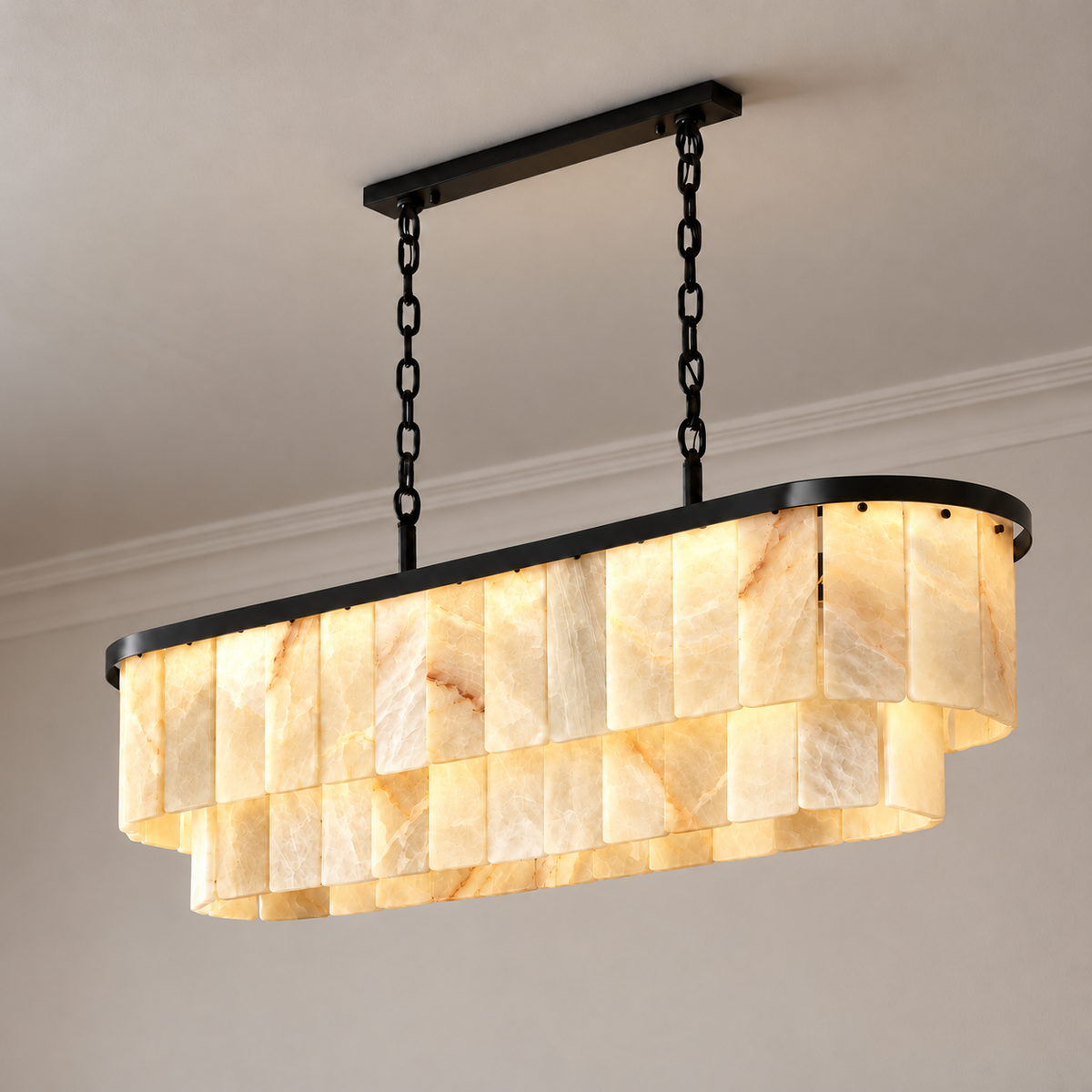 Honey onyx linear chandelier with black frame, illuminated.