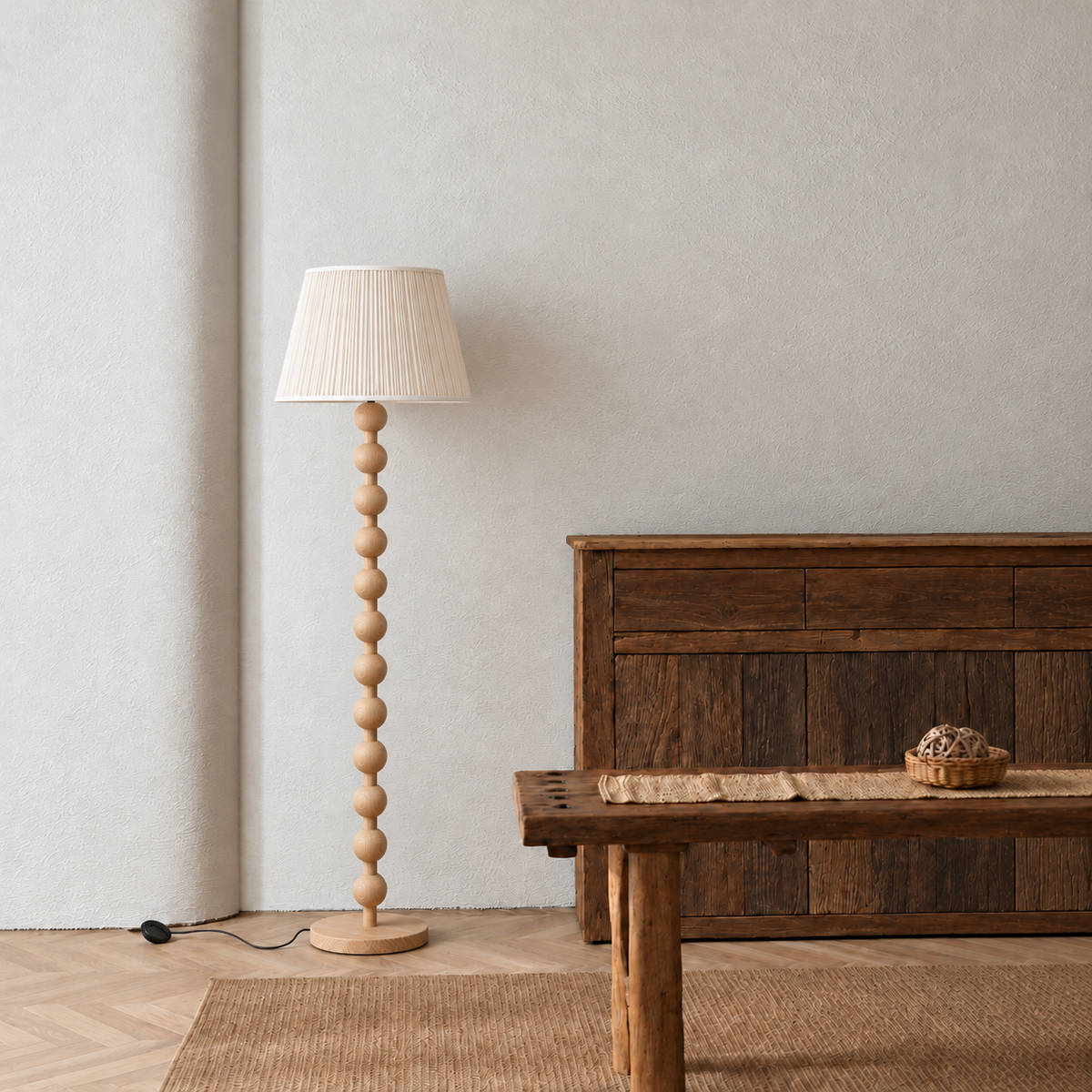 Sirmione Natural Wood Floor Lamp with cream fine pleated shade in a furnished room.
