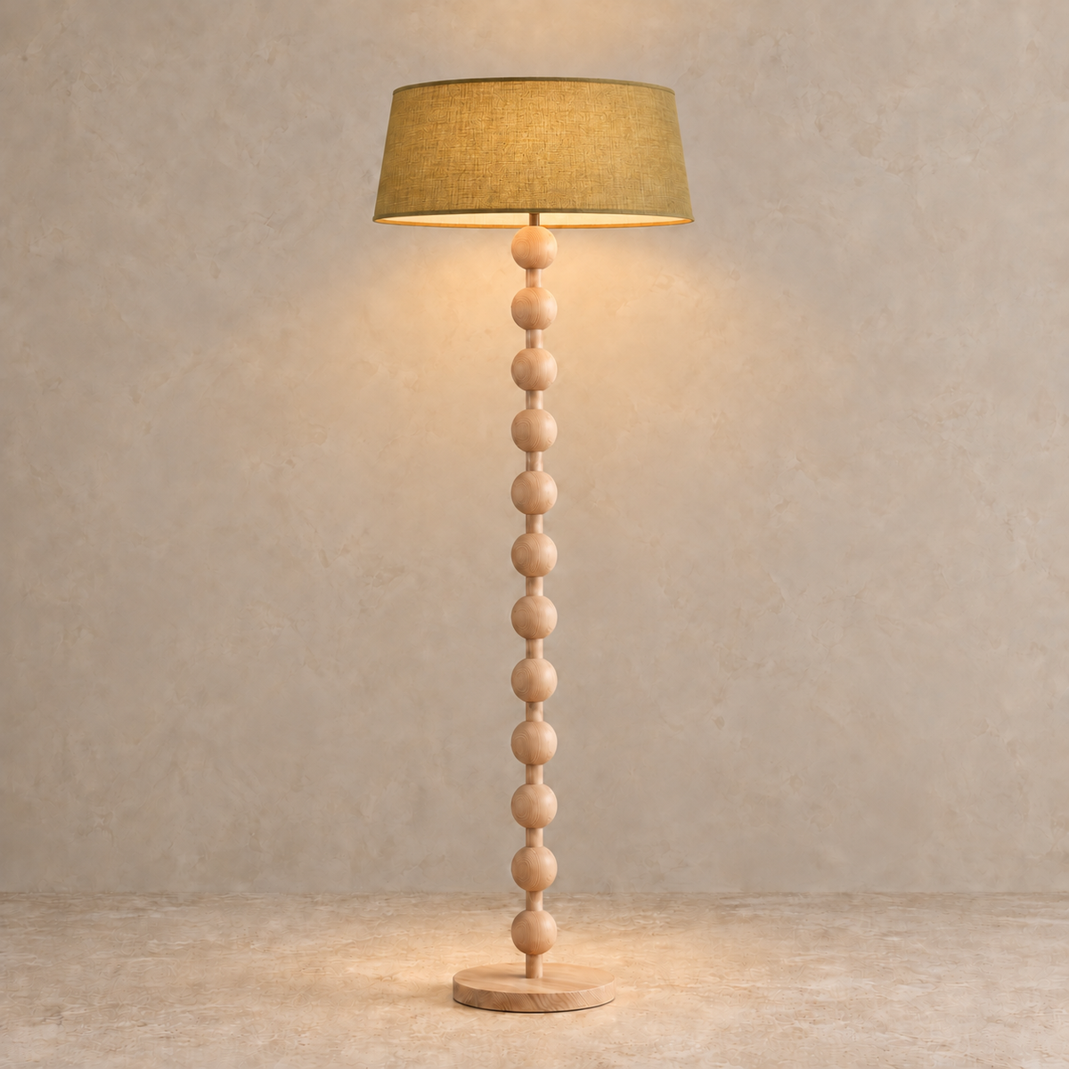 Sirmione Natural Wood Floor Lamp with olive linen shade, illuminated in natural daylight.