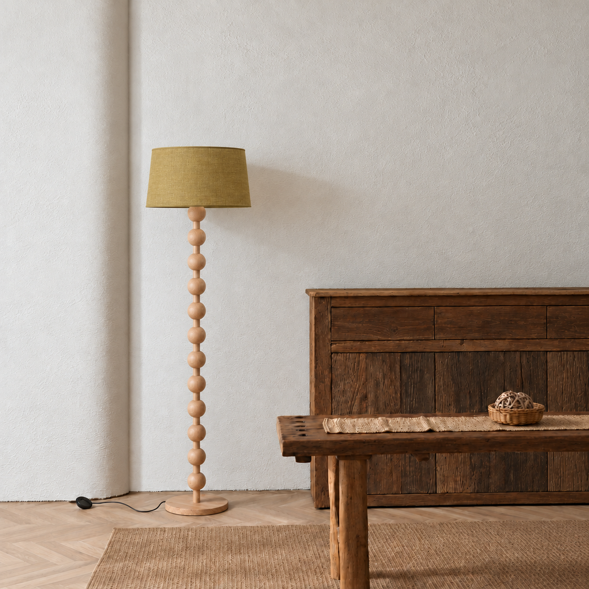 Sirmione Natural Wood Floor Lamp with olive linen shade in a furnished room.