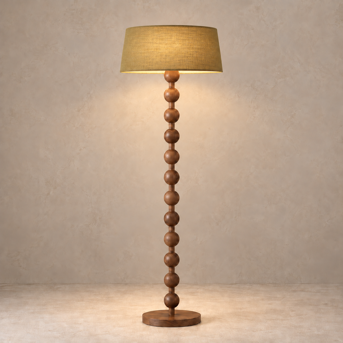 Sirmione Walnut Floor Lamp with olive linen shade, illuminated in natural daylight.