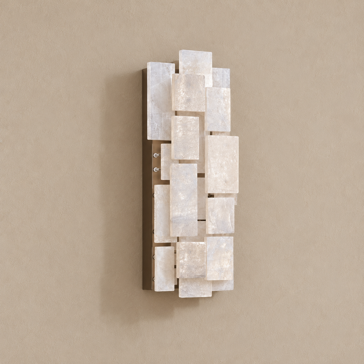 Angled view of the stacked marble and crystal blocks on their stainless steel back plate.