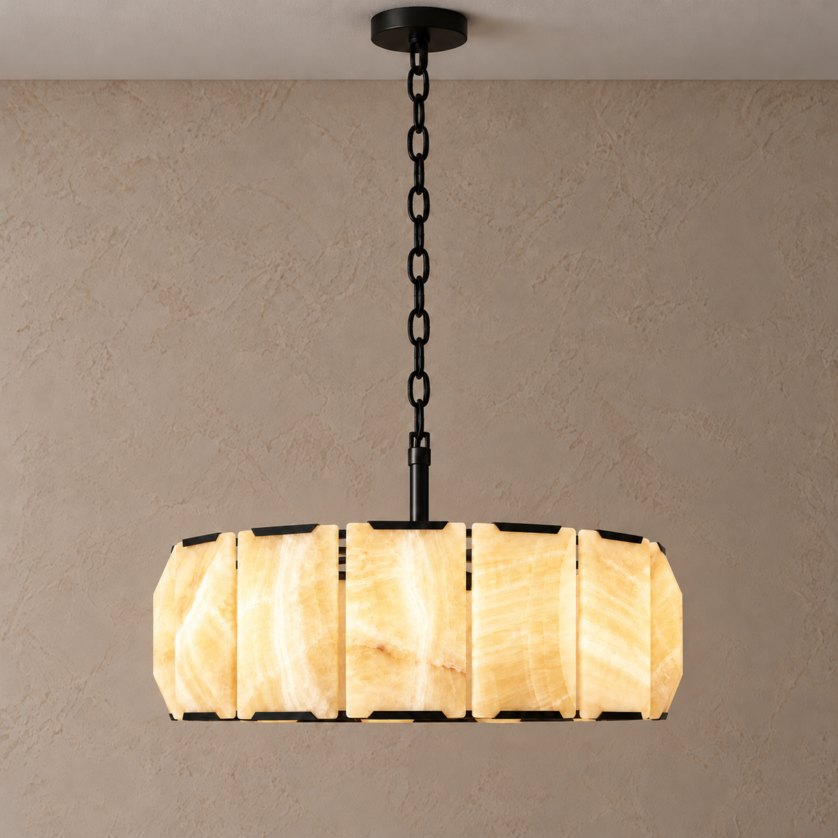 Honey onyx halo chandelier with black frame, illuminated.