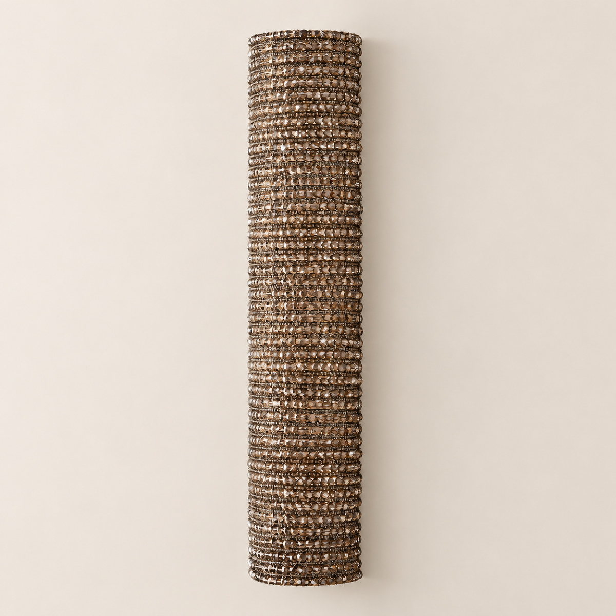 Additional view of the tall amber crystal column and its curved rows of facets.