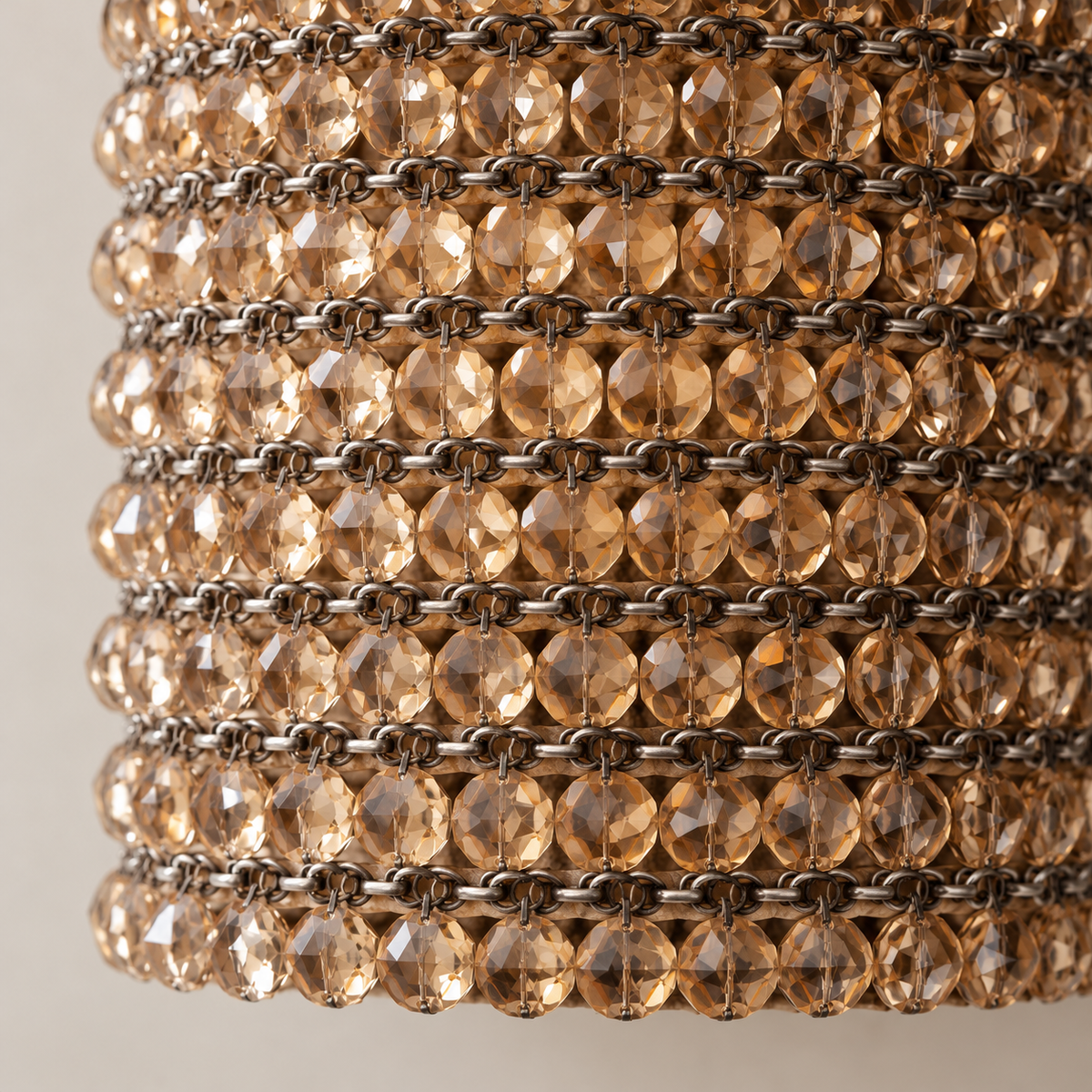 Close-up of faceted amber crystals and their metal settings.