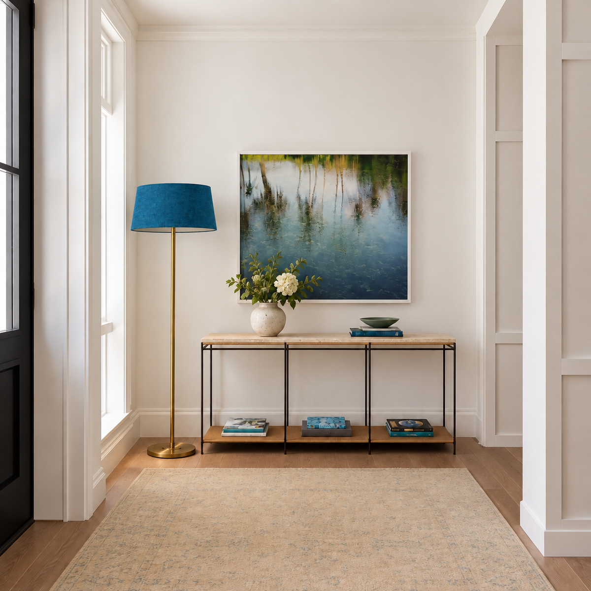 Brushed Brass Floor Lamp with petrol blue linen shade in a furnished room.