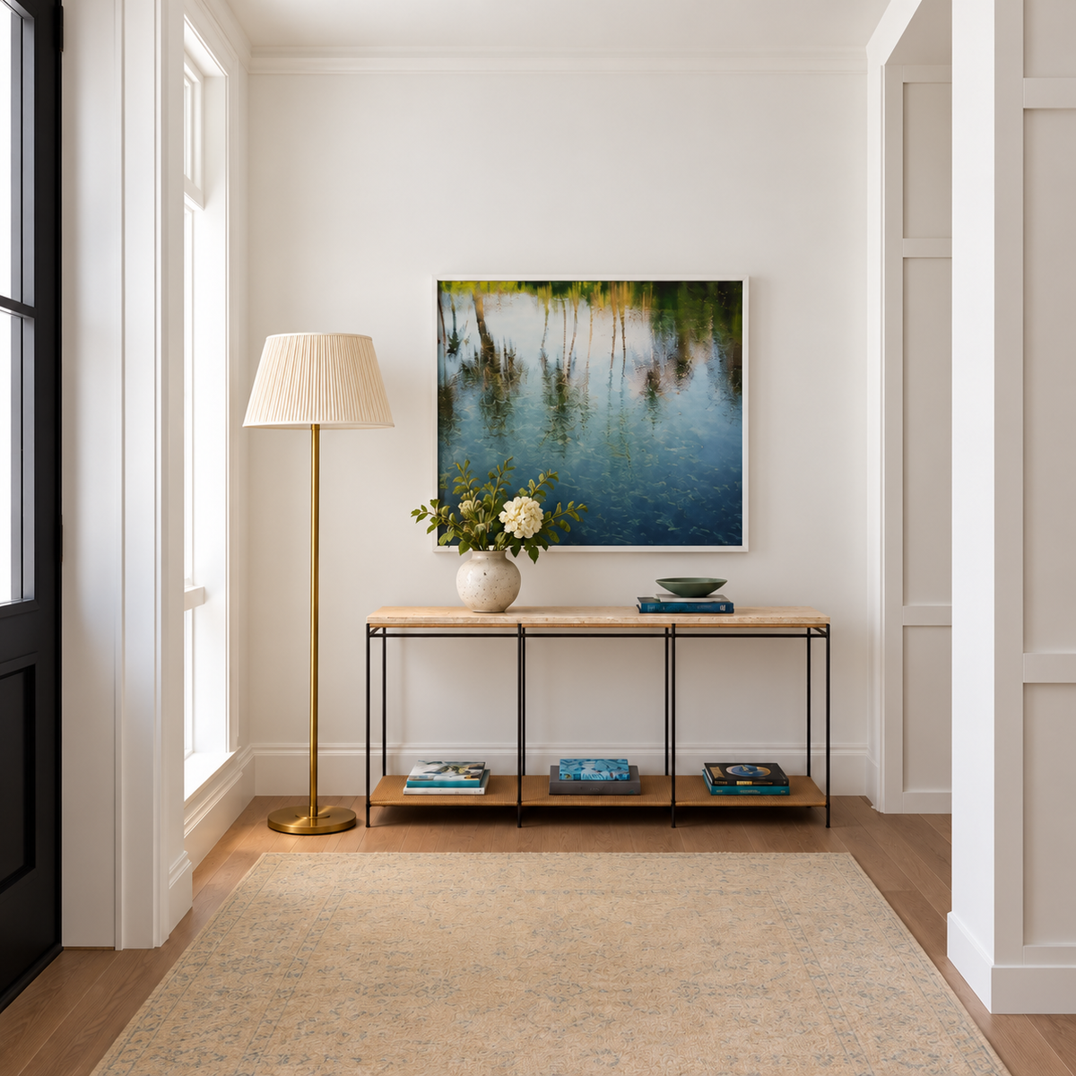 Brushed Brass Floor Lamp with cream fine pleated shade in a furnished room.