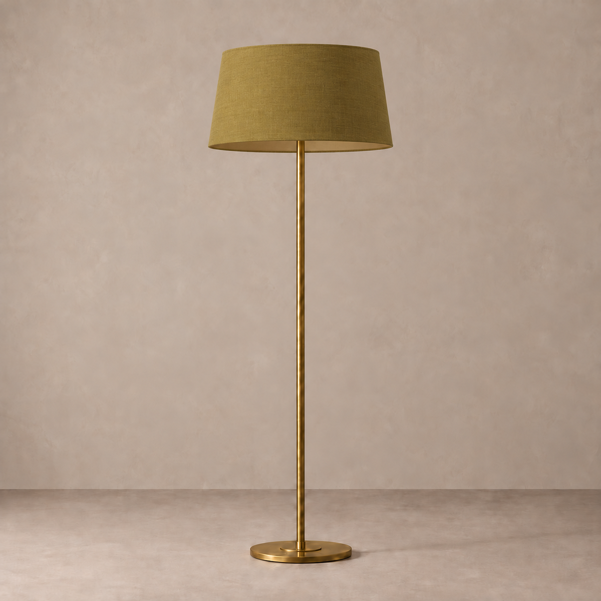 Brushed Brass Floor Lamp with olive linen shade, unlit against a stone-beige background.
