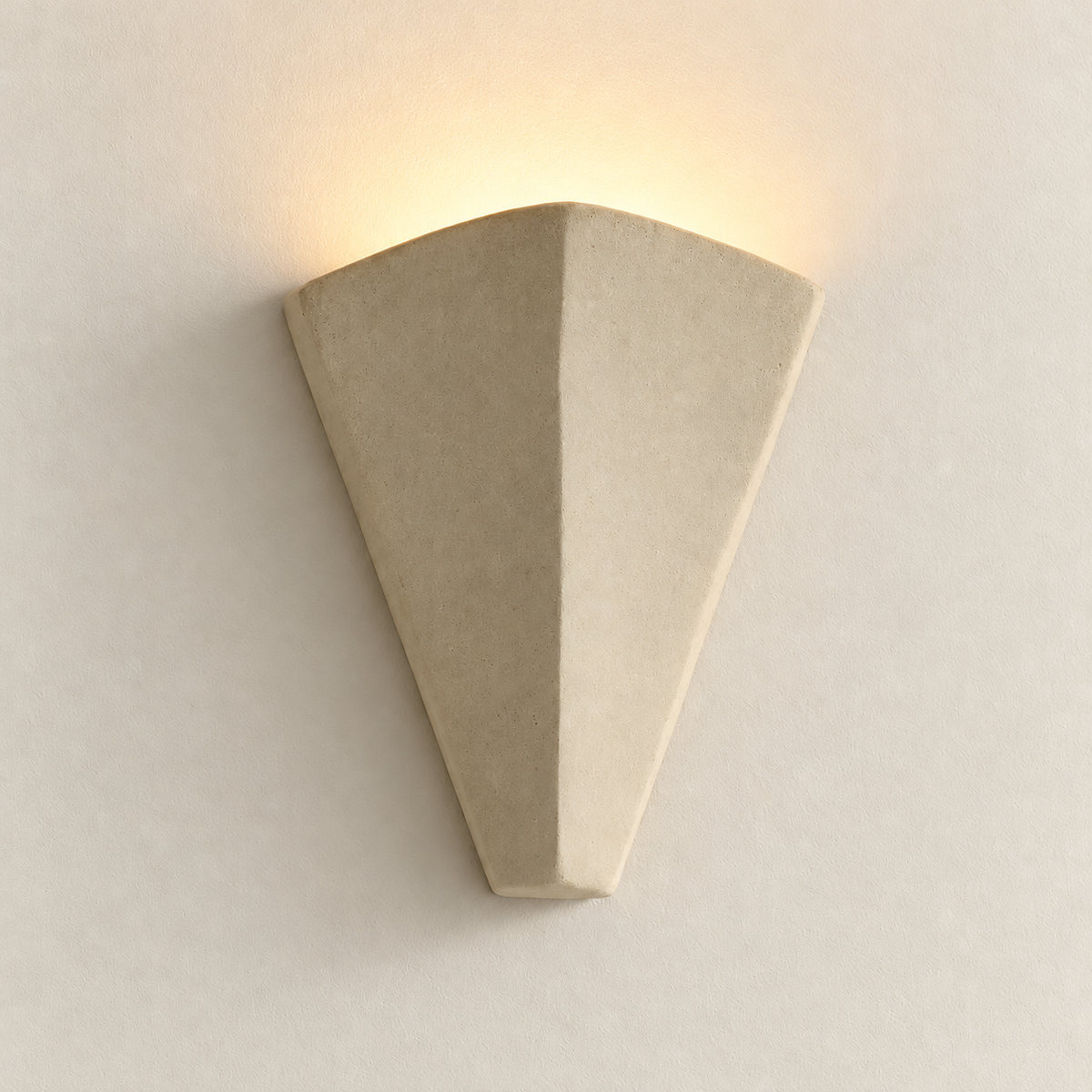One-tier beige plaster wall sconce with a soft uplight, matching the unlit view on warm ivory.
