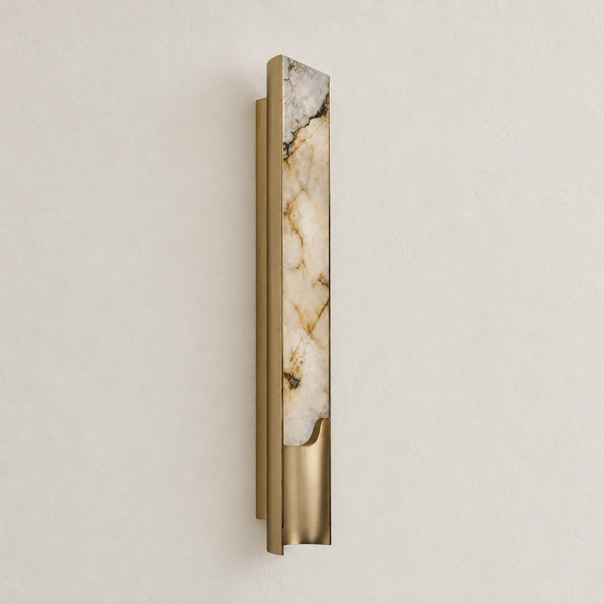 Angled view of the large 90 cm onyx sconce and curved brass housing.