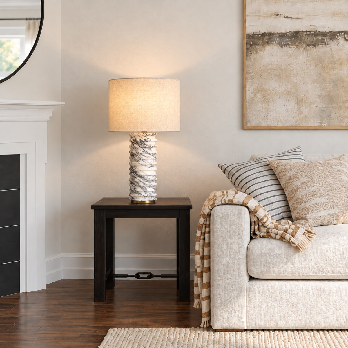 Ribbed marble table lamp beside a cream living-room sofa