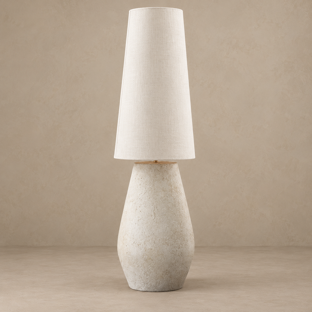 Como plaster floor lamp with a tall tapered linen shade, switched off against a stone-beige background