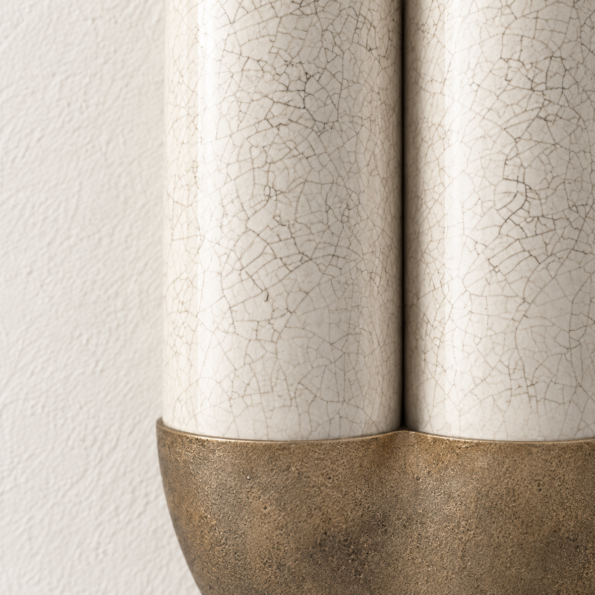 Close-up of fine crackle glaze on the ivory ceramic panels.