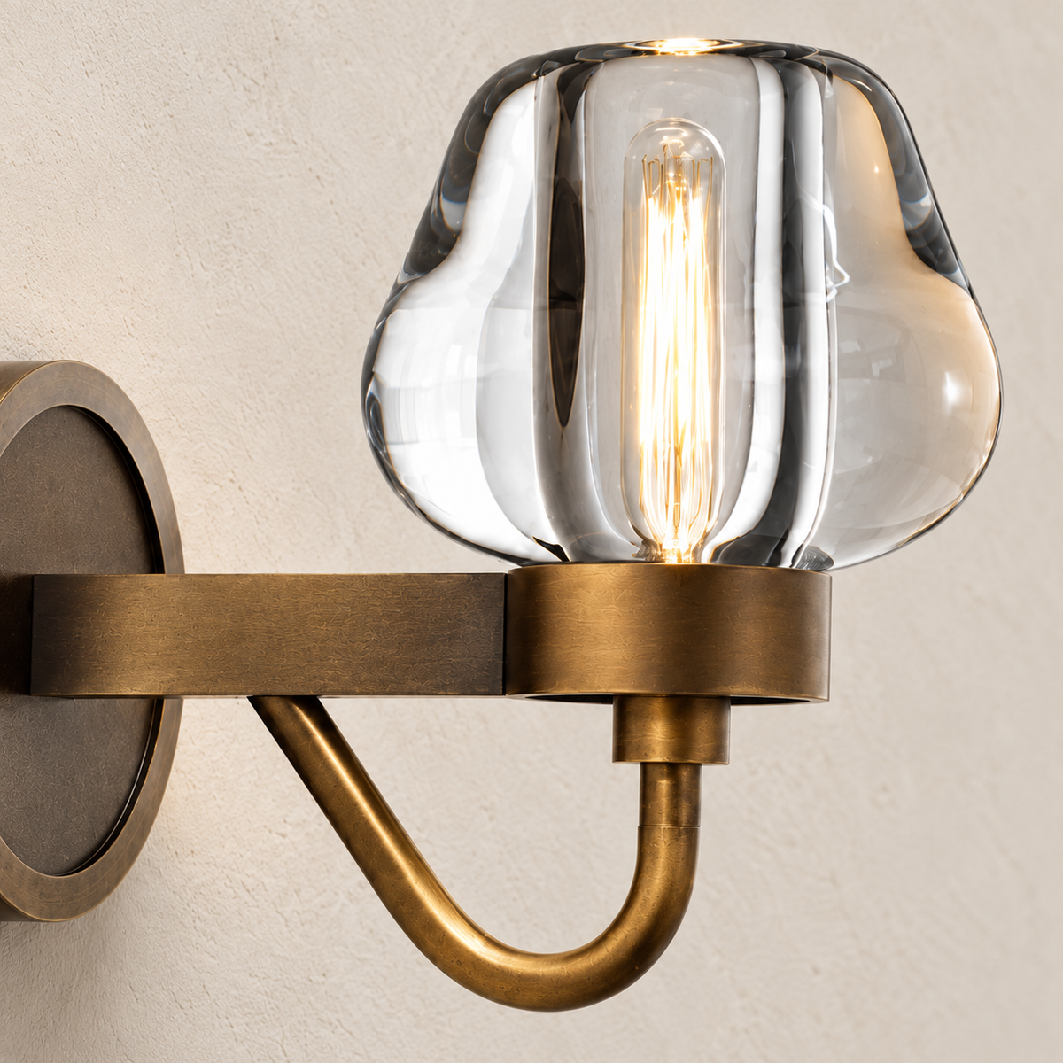 Detail of the hand-formed crystal shade and brass holder.