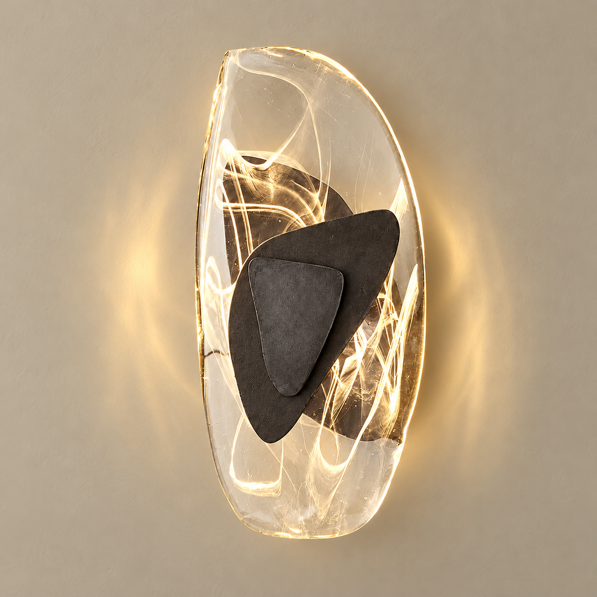 Crystal and resin oval wall sconce, illuminated on a stone-beige wall