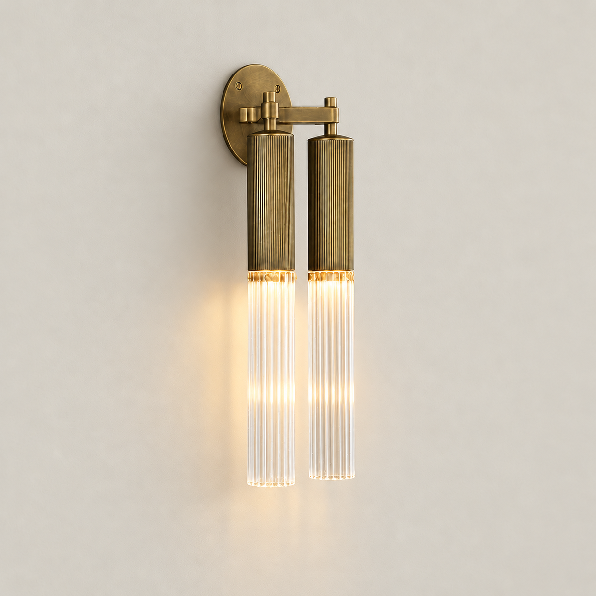 Flume double wall light with both downward glass cylinders illuminated.