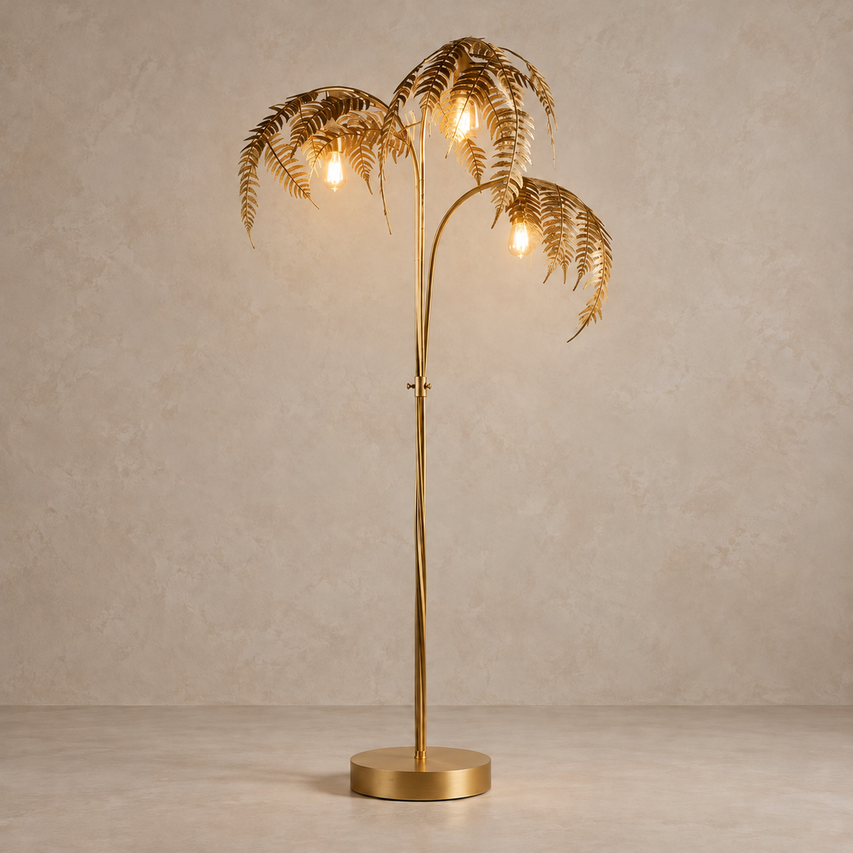 Three hanging bulbs illuminated beneath the gold palm fronds.