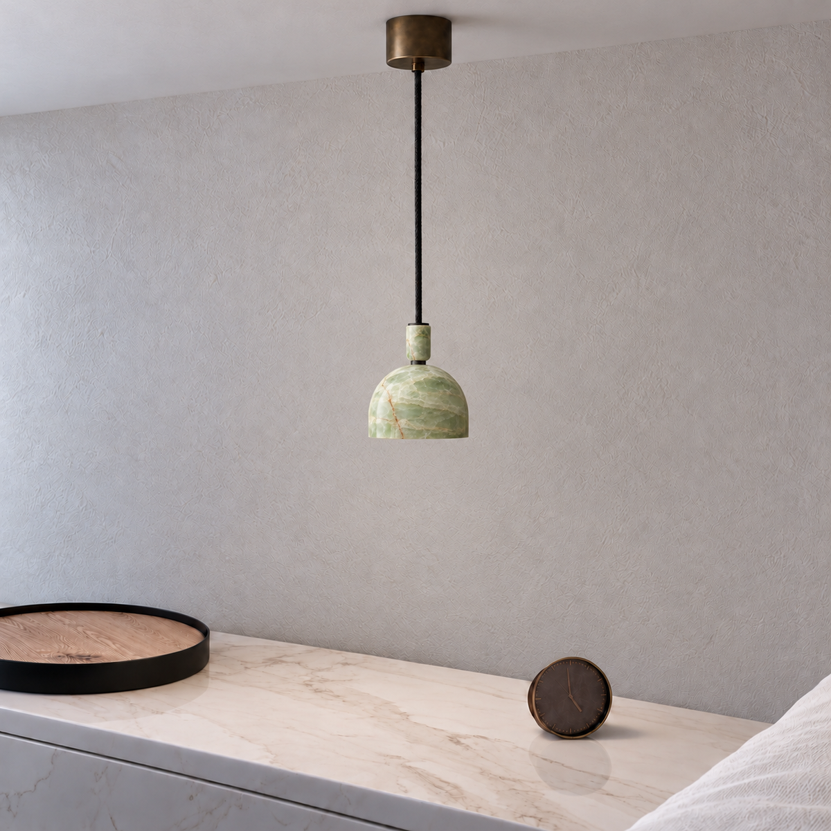 Green Onyx Dome Pendant Light above a stone bedside ledge, shown in natural daylight.