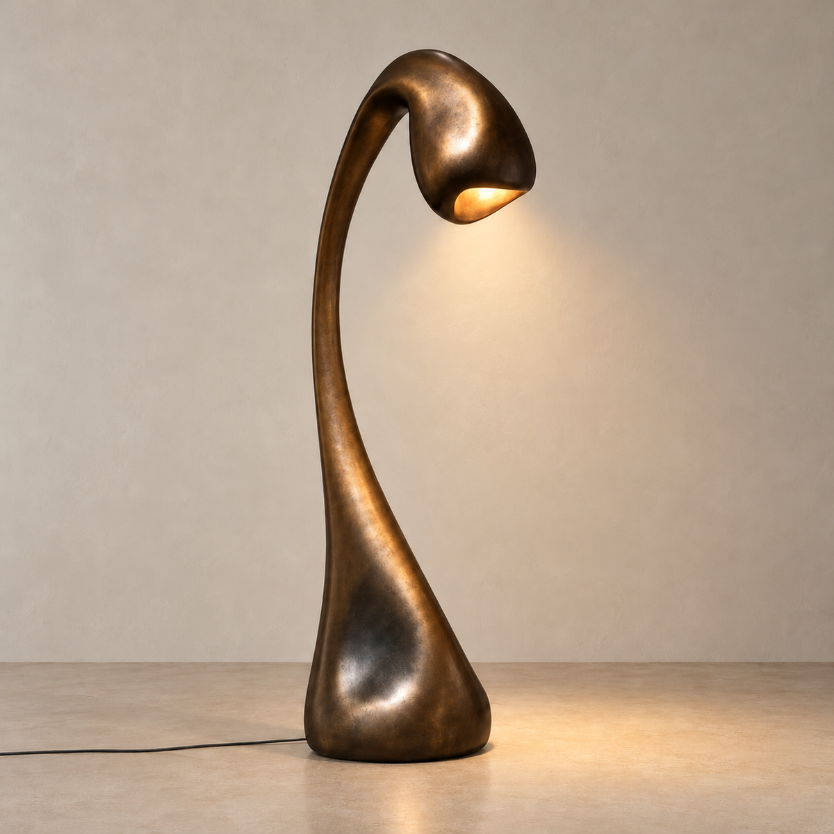 Hadrian Arc floor lamp illuminated, casting a small pool of light below its curved head.