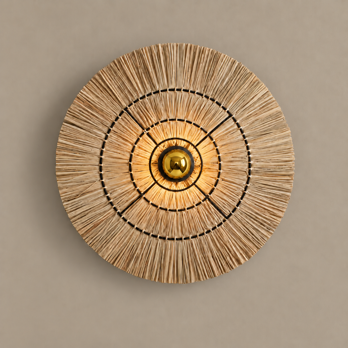 Rattan disc wall sconce, illuminated on a stone-beige wall
