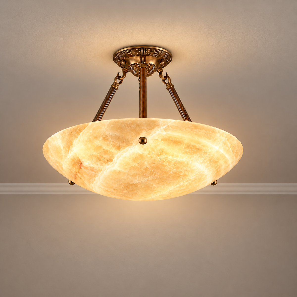 40 cm honey onyx semi-flush light with ornamental brass supports, illuminated.